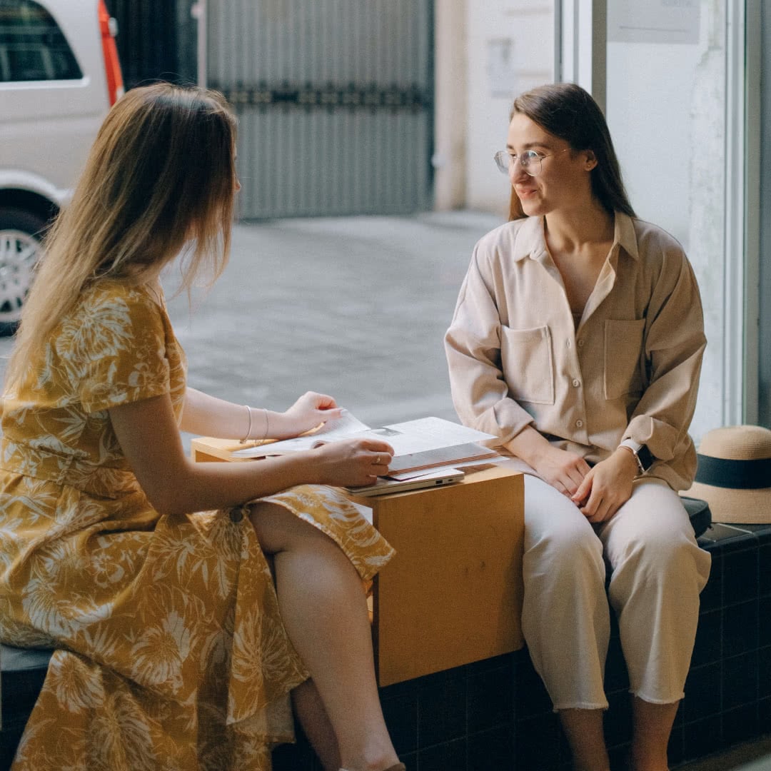Women talking about their art work