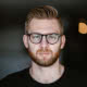 Portrait of Symposia author Colin Fisher
